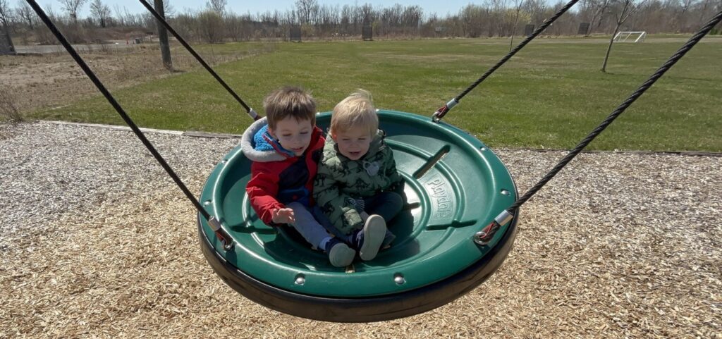 Circle Swing with the Boys in it at Heartland Forest