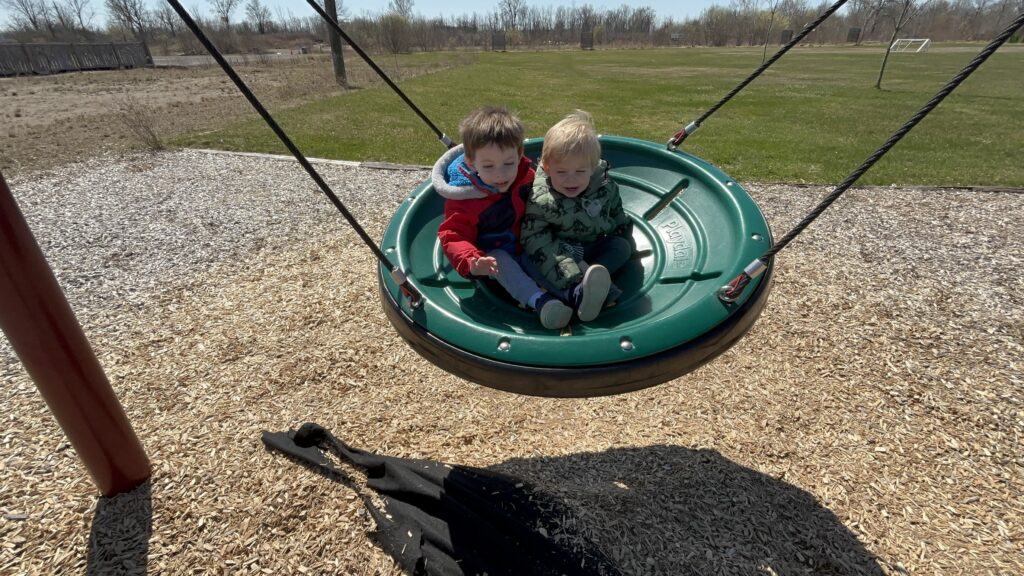 Kids swinging in a free park
