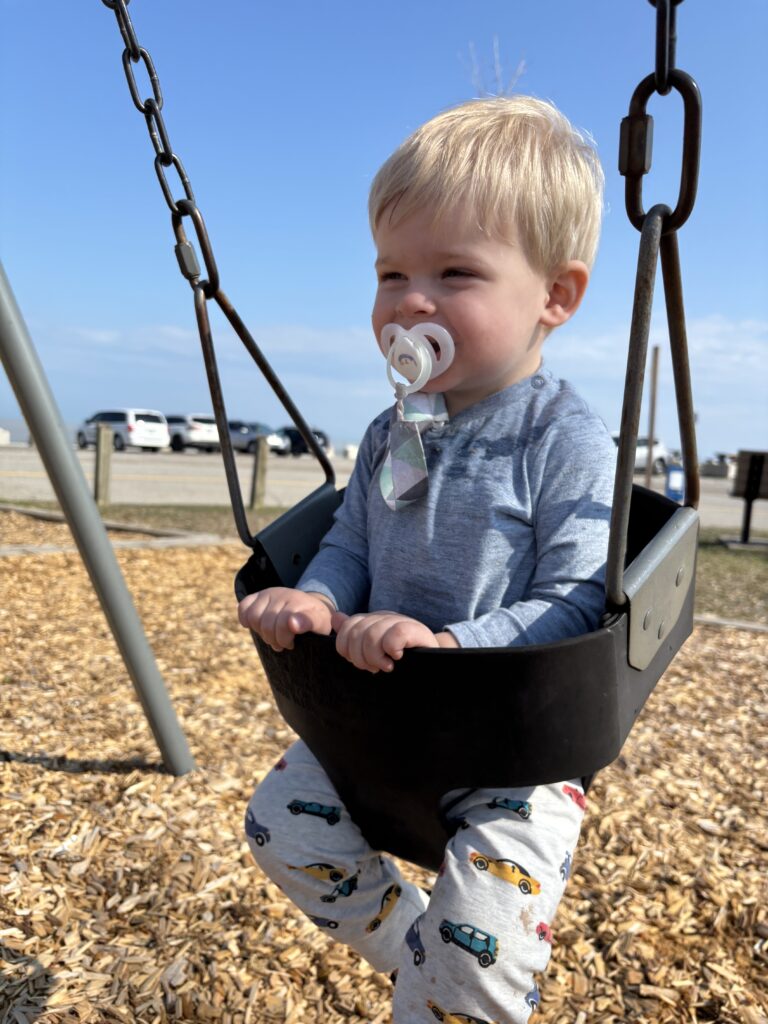 swinging at the perfect beach playground